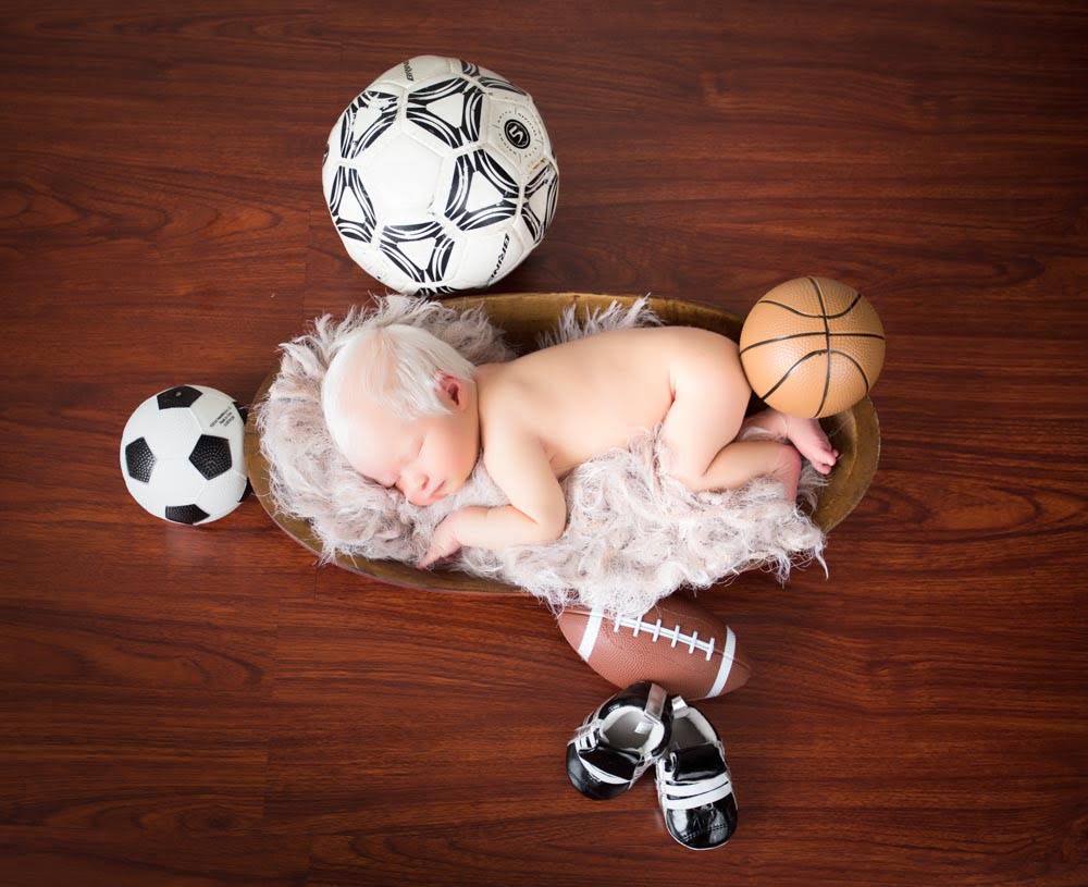 Adorable sports-themed newborn photography germantown md