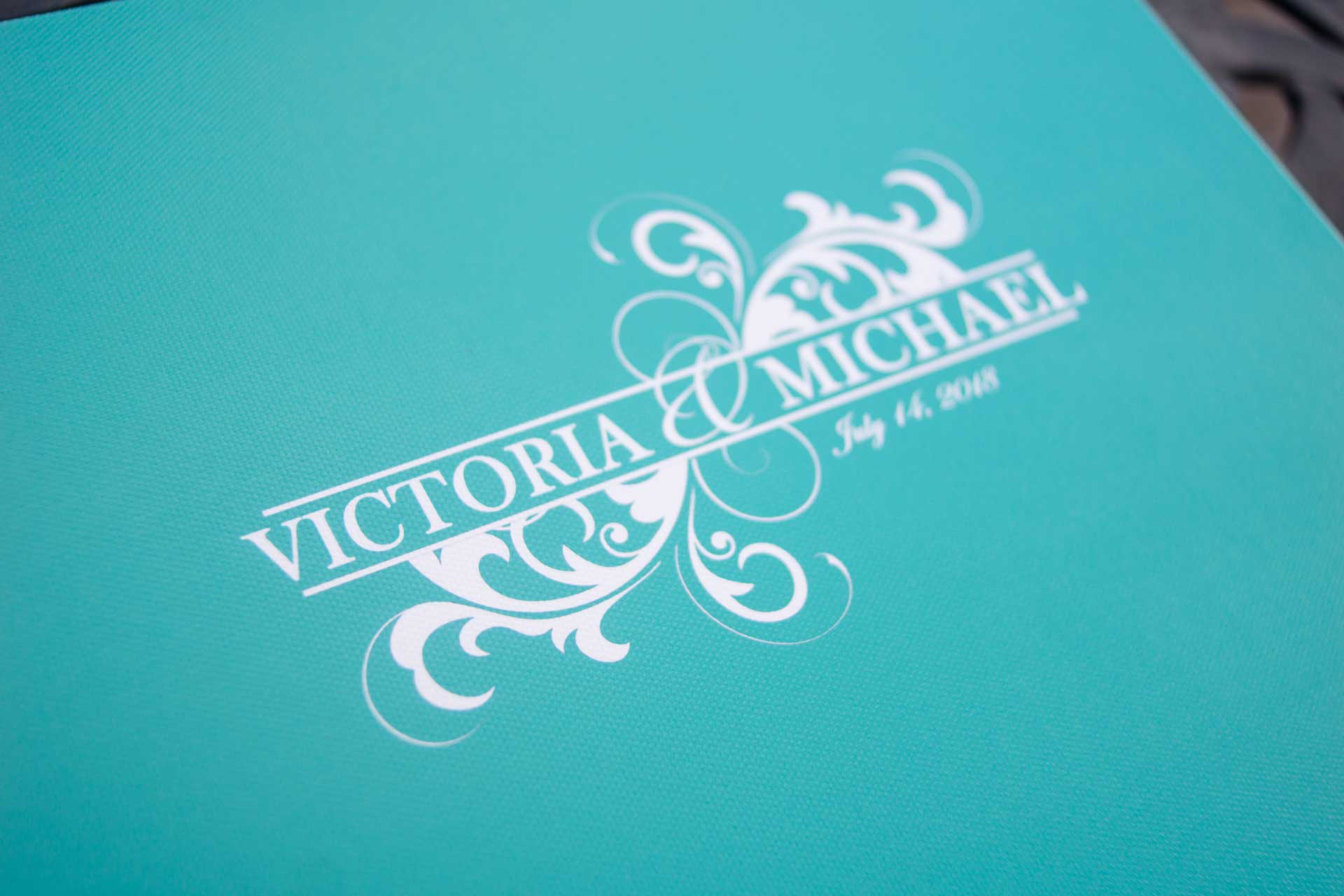 Creating a personalized monogram on a colorful canvas cover is a unique way to personalize an album.